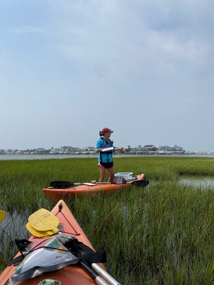 Channing leading kayaking tours through the Galveston wetlands